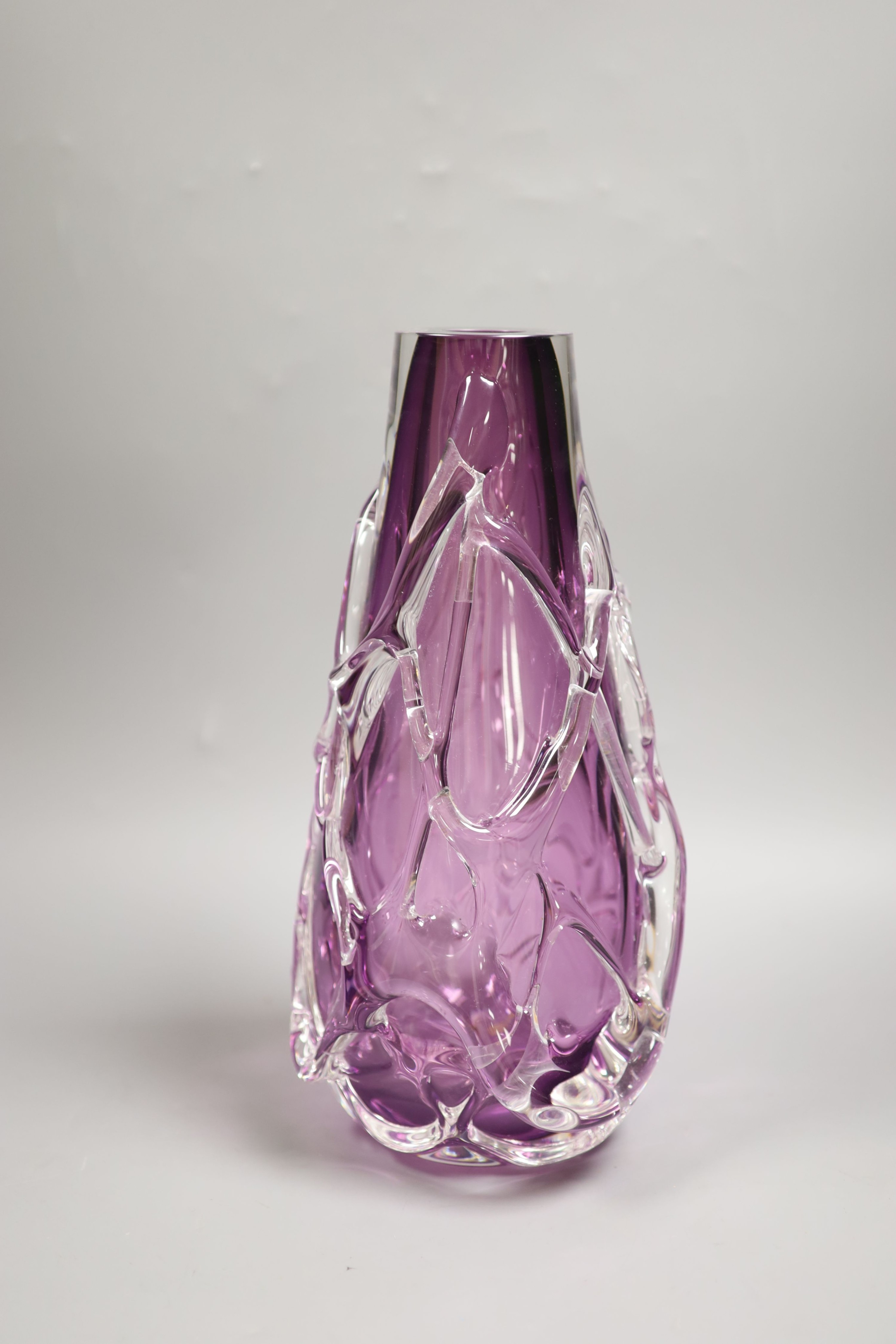 A large amethyst and clear cased glass vase